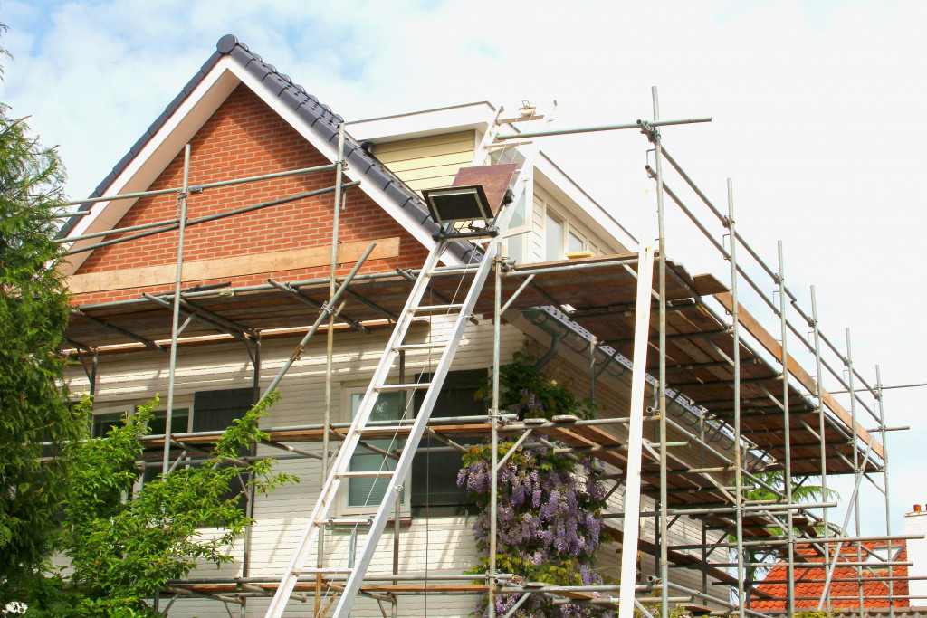 a house renovation with scaffolding