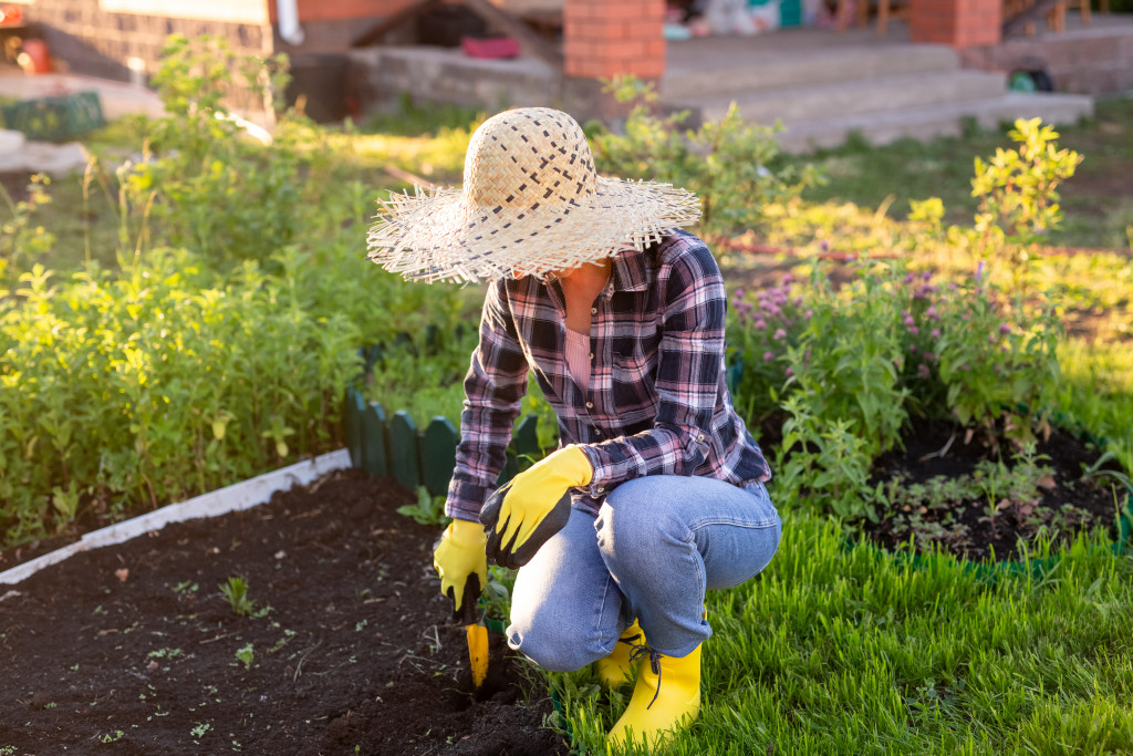a woman digging a soil